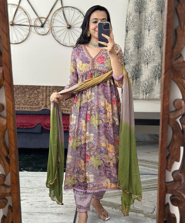 Muslin Alia Cut Suit Set: A Symphony of Hand Embroidery, Zari Weaving, and Prints